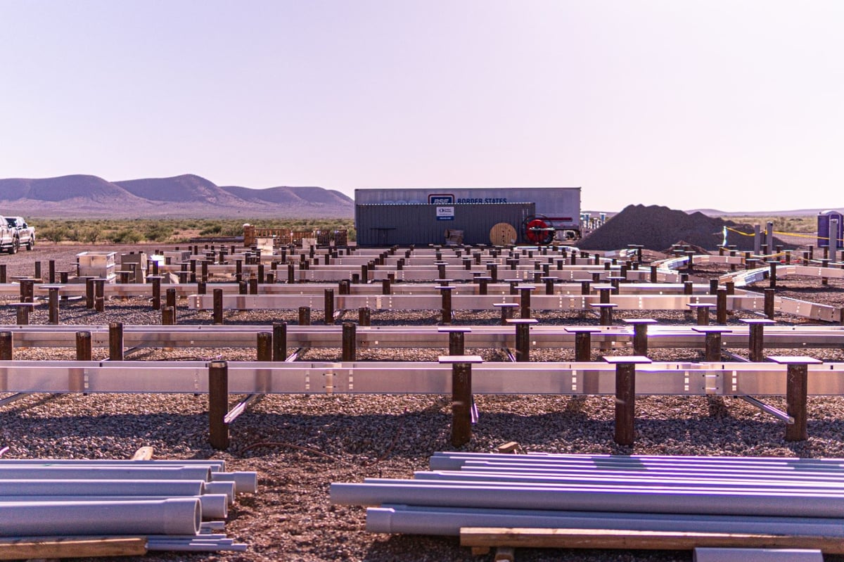 Solar pile array and fabricated steel components staged in West Texas desert site