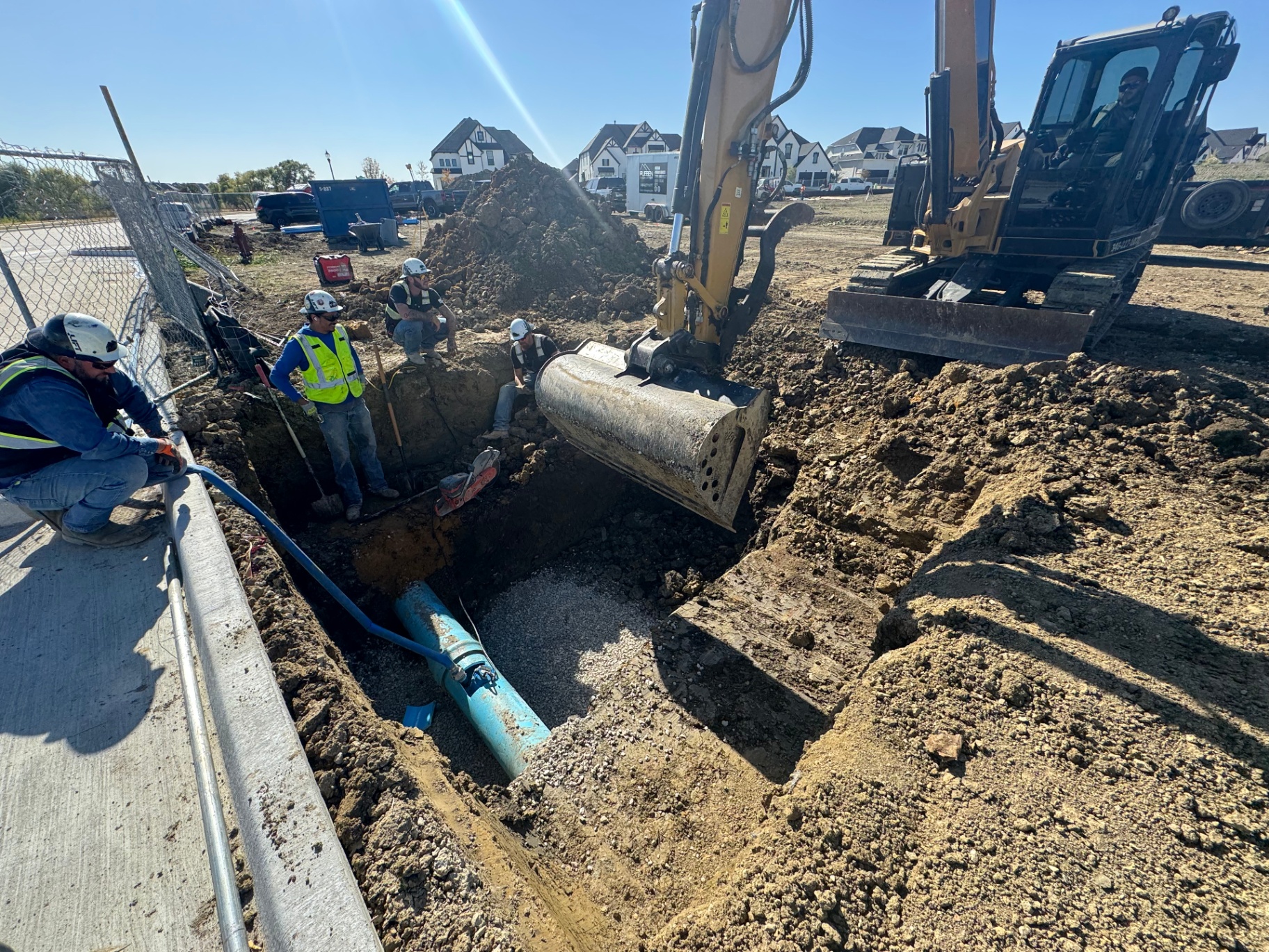 Excavator trenching for fireline installation