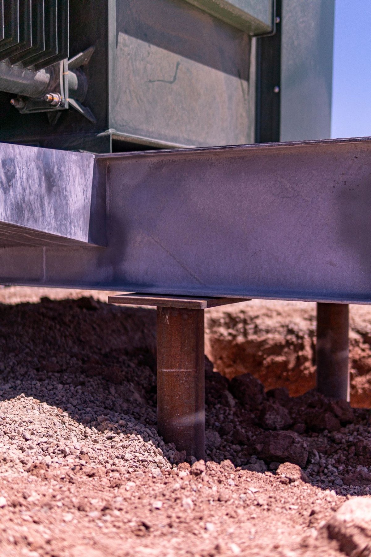 Close-up of welded steel pile cap connection on driven steel piles