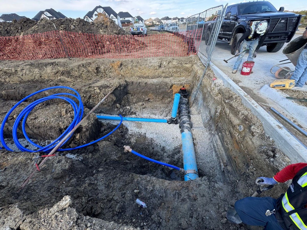 Fireline pipe tie-in with curb cut