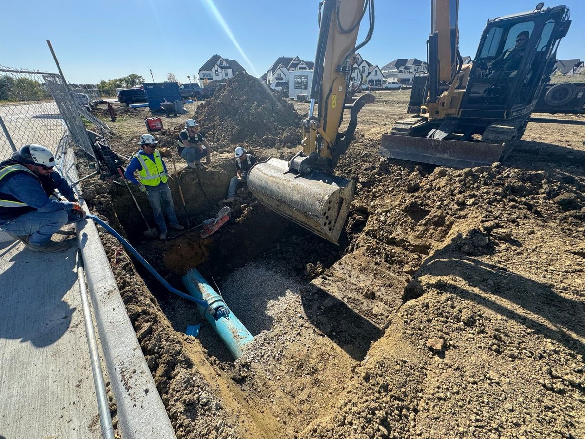 Excavator trenching for fireline installation
