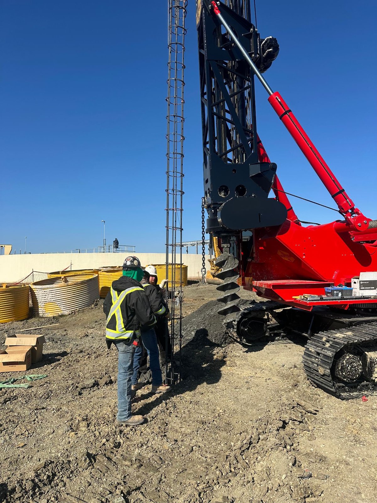 Rebar cage being placed into a drilled shaft