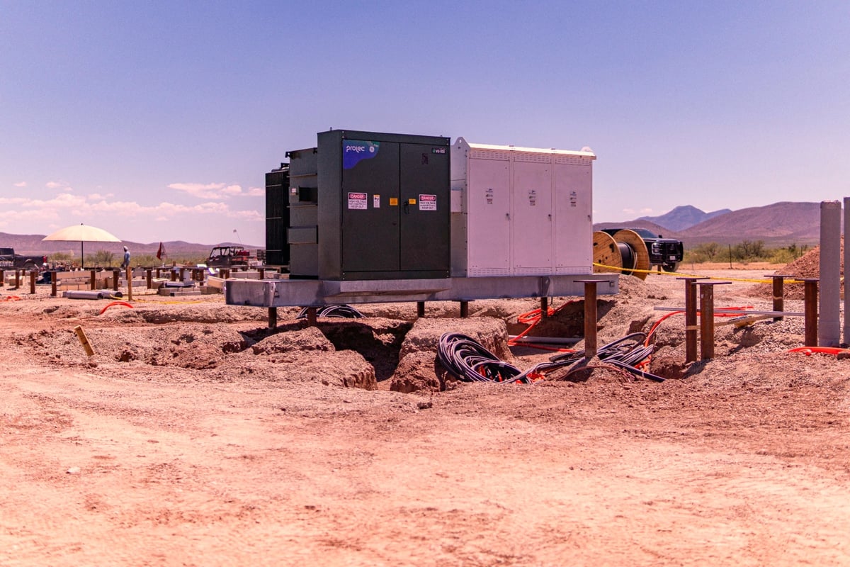 Substation transformer set on pile cap foundations with conduit trenches in progress