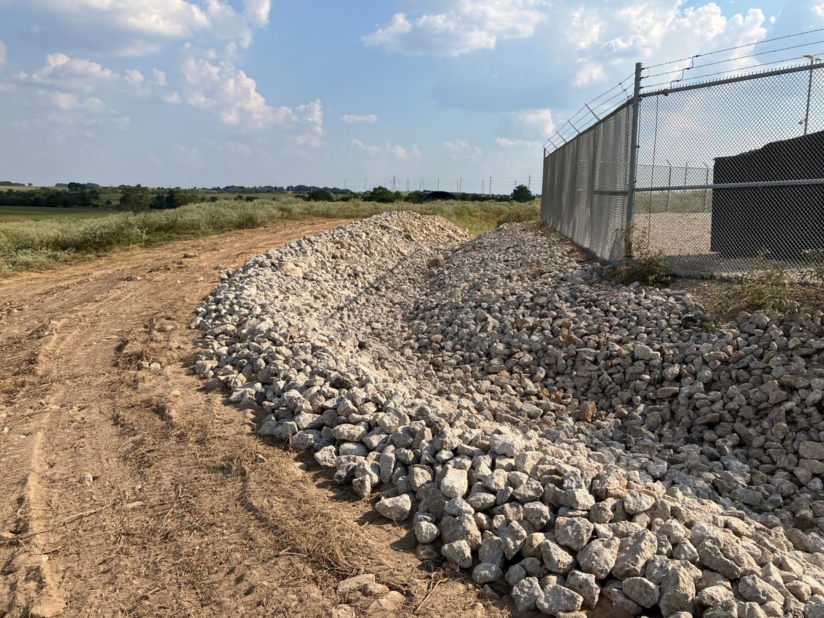 Rip-rap erosion control along substation perimeter fence