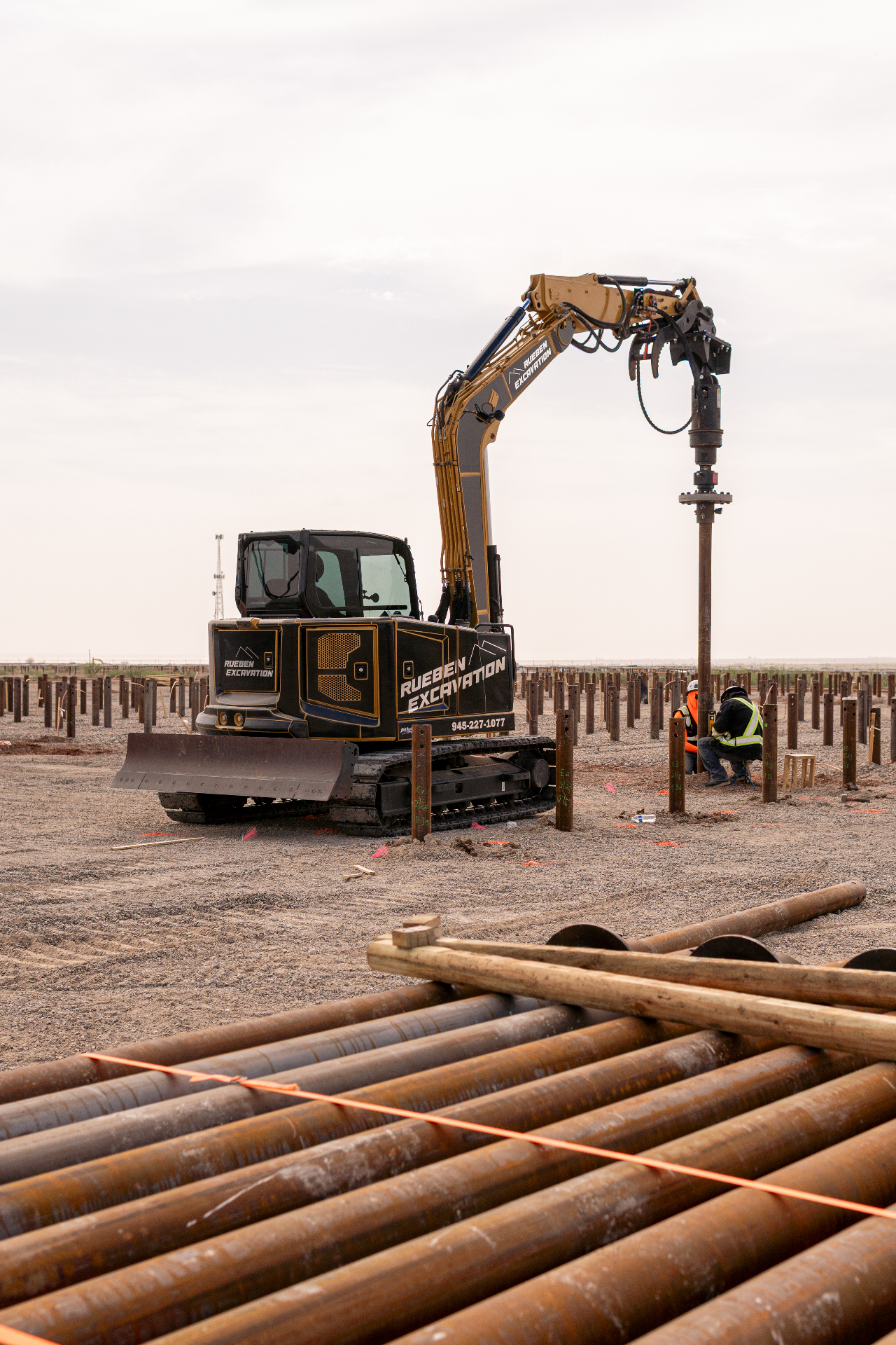 Rueben Group drive equipment rotating a helical pile into the ground during installation