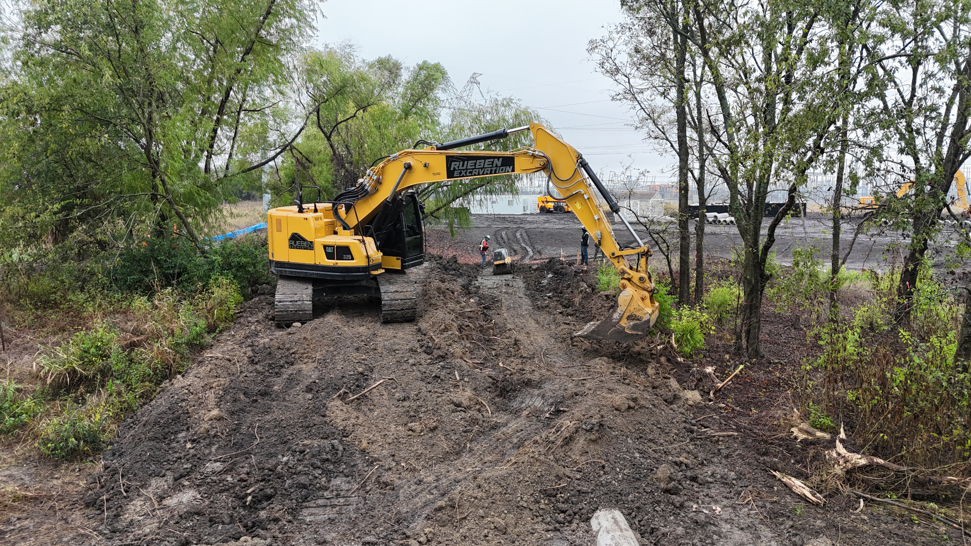 Rueben Excavation CAT 325 clearing access at substation site