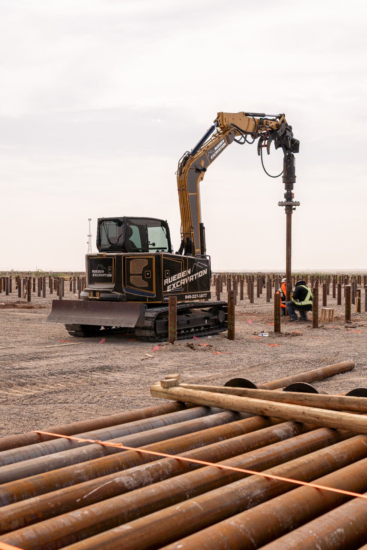 Rueben Group drive equipment rotating a helical pile into the ground during installation